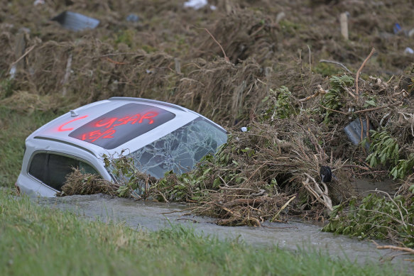 A car has been washed into a ditch just west of Napier. Cyclone Gabrielle caused widespread destruction across New Zealand’s North Island.