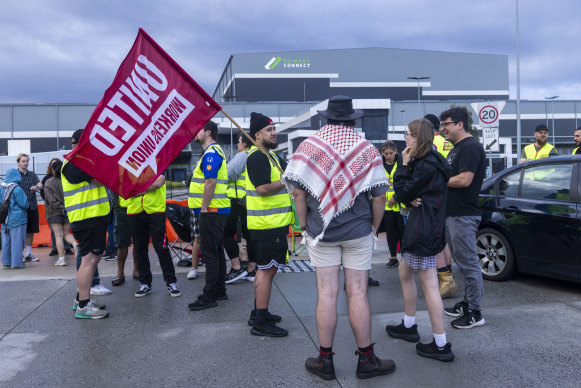 United Workers Union members outside the Dandenong South distribution centre on Tuesday.