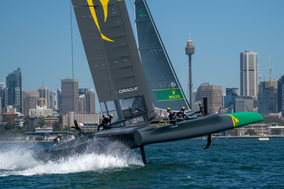 The Australian SailGP Team F50, skippered by Tom Slingsby, flies across Sydney Harbour in 2019. 