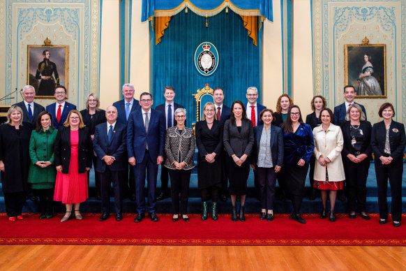 Members of the new-look Victorian ministry pose for a group photo at Government House during the swearing-in ceremony on Monday.