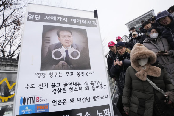 A banner demanding the arrest of impeached South Korean President Yoon near the presidential residence in Seoul.