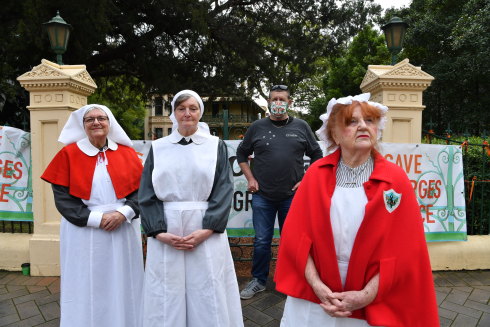 Brislington medical and nursing museum workers Robyn Dyball,  Leone Ormsby and Amanda Voegs with Darren Greenfield, CFMEU state secretary, outside Willow Grove.