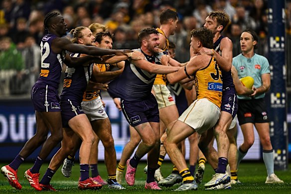 Luke Ryan wrestles with Calsher Dear in an action-packed contest at Optus Stadium.