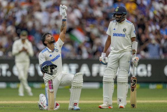 Nitish Kumar Reddy celebrates reaching three figures.