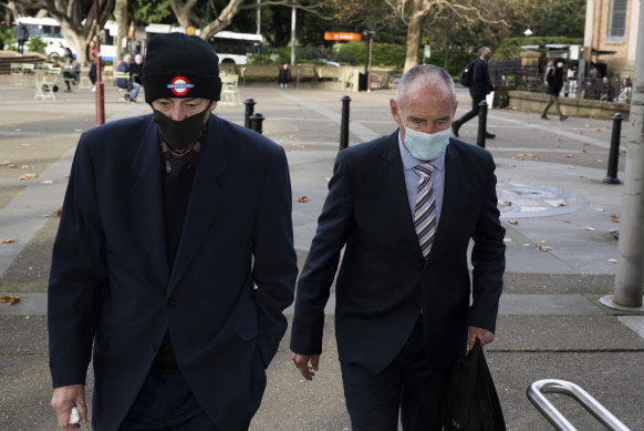 Chris Dawson (right) arrives at the NSW Supreme Court on Friday with his older brother, Peter Dawson.