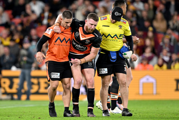 Jackson Hastings is helped off after Pat Carrigan’s illegal tackle.