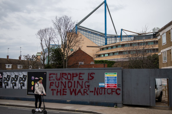 Graffiti on boarding at a construction site next to Chelsea Football Club at Stamford Bridge on March 11, 2022 in London after laws forced out owner Roman Abramovich.