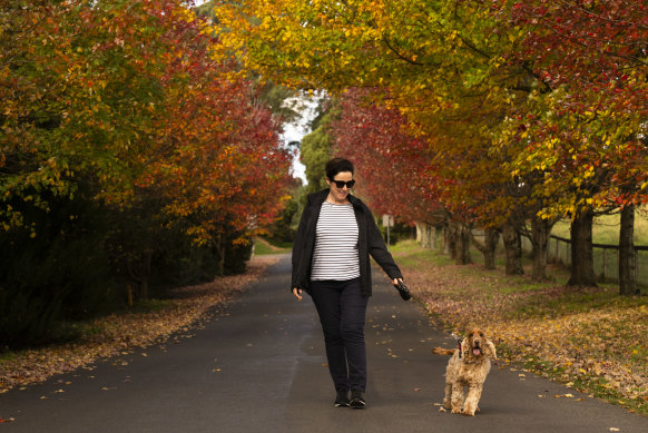 Karon walks her dog, George, in Burrawang, NSW.
