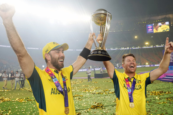 Glenn Maxwell celebrates last year’s 50-over World Cup win with David Warner.