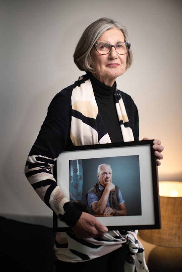 Pat Quinn holds a photo of her late husband Michael, who took part in the trial.