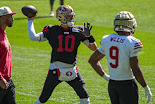 San Francisco 49ers quarterback Mac Jones works out during practice in Melbourne.