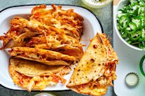 Chilli crisp chicken tacos with coriander rice and salsa.