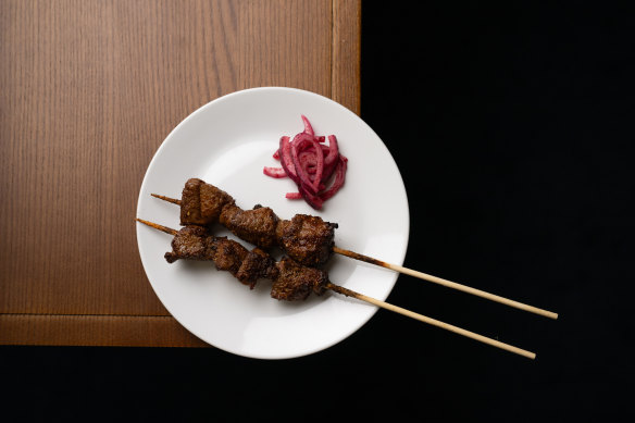 Char-grilled lamb “firepops” are spiced with sesame and cumin dukkah.