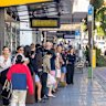 Commuters queue for a B-line bus at Dee Why on Monday morning.