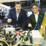 Minister for Industry and Science Ed Husic in front of a trapped ion quantum computer at the quantum labs at Sydney University.