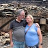 Craig Saxon and Sarra Saxon-Gill return to their home destroyed by the Koolewong bushfire.