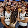 The Brisbane Broncos’ Josiah Karapani and Ben Hunt with the Provan-Summons Trophy.
