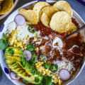 Taco soup with all the toppings.