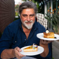 Preston enjoying tarts at Millstone Patisserie.