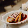 Duck a l’orange, the slices of rosy pink breast lapped by an orange scented glaze.