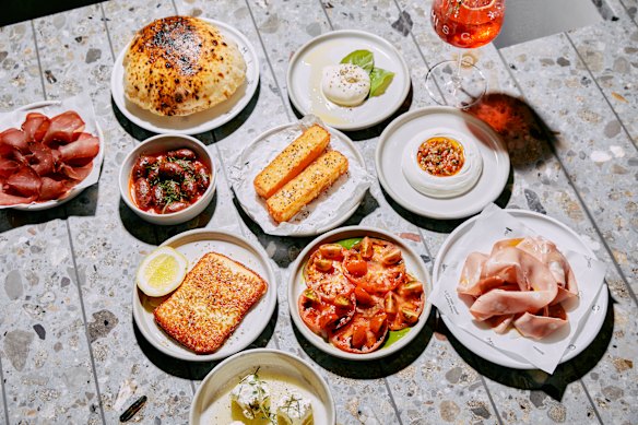 A spread including house-made pita, burrata, white bean hummus, mortadella and basturma.