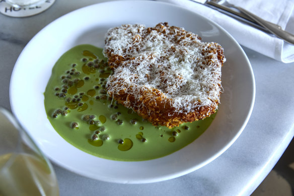 Pork cotoletta with jellybean-green caper and rocket sauce.