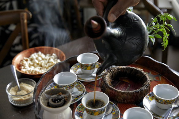 An Ethiopian coffee tray with burning incense.