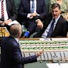 Opposition Leader Angus Taylor reacts as Prime Minister Anthony Albanese speaks during question time at Parliament Ho...