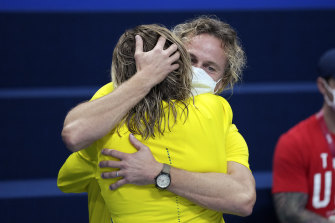 Dean Boxall and Ariarne Titmus hug it out.