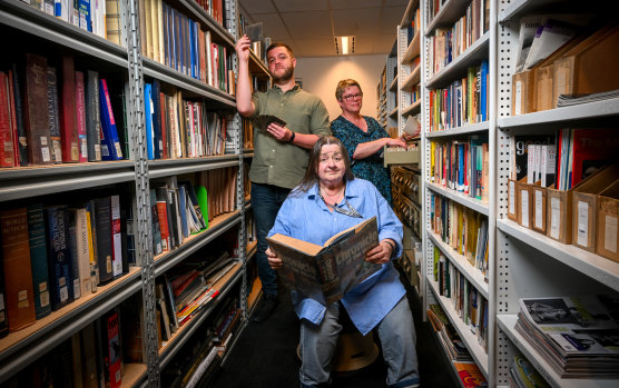 The Age librarians Michelle Stillman (front), Andrew Brooks and Maria Paget write quizzes for the newspaper.