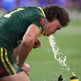 Reece Walsh vomits after his try.