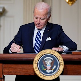 President Joe Biden signs an executive order on climate change earlier this year.