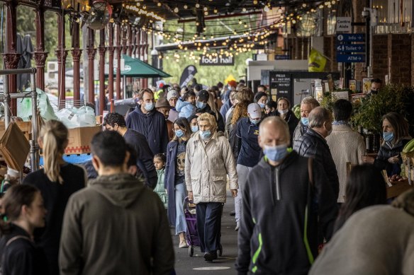 Shoppers with masks at South Melbourne Market yesterday as Melbourne’s COVID-19 restrictions continued. 