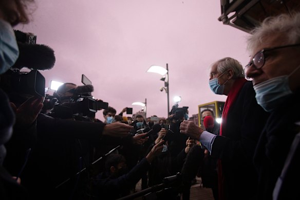 Lawyers George Henri Beauthier, second right, and William Bourdon, right, representing the National Council of Resistance of Iran, speak with the media as they arrive at the courthouse in Antwerp, Belgium.