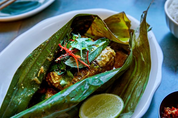 Market fish in banana leaf with coriander seeds and Vietnamese mint.