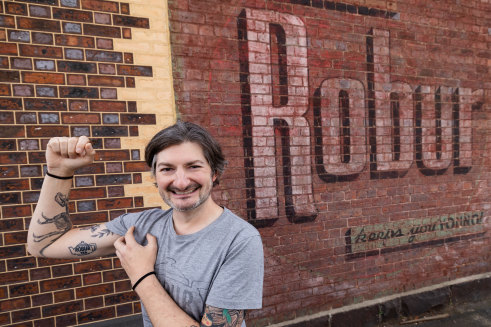 Ghost sign chaser Sean Reynolds, in Carlton North, had a Robur tea image tattooed on his arm.