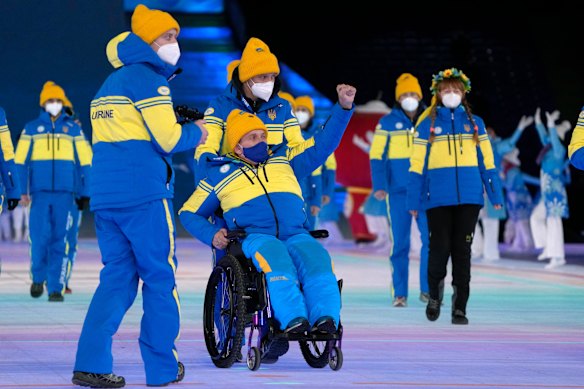 Ukrainian athletes arrive at the opening ceremony of the 2022 Winter Paralympics in Beijing.