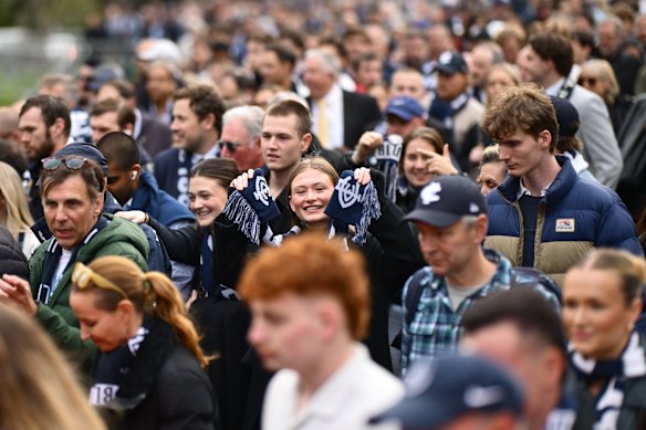 Fans head into the MCG.