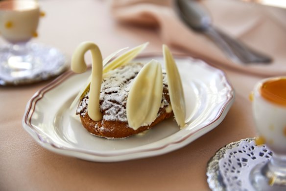 The swan with coffee cream-piped choux pastry and chocolate.