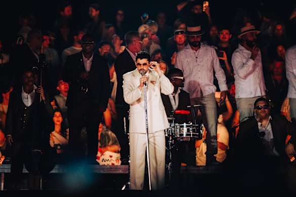 Bad Bunny has the stadium captured before even singing a note.