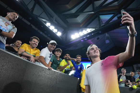 Brazilian sensation Joao Fonseca takes a selfie with some of his fans.