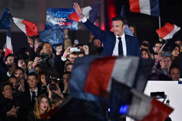 Emmanuel Macron celebrates winning a second term back in April. 