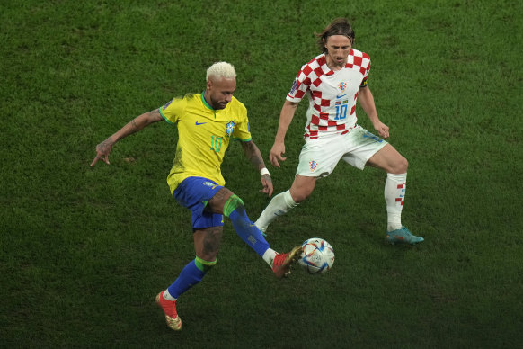 Brazil’s Neymar, left, and Croatia’s Luka Modric vie for the ball.