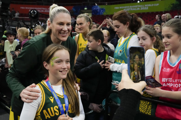 Lauren Jackson poses for a picture with a young fan at the FIBA Women’s World Cup in Sydney.