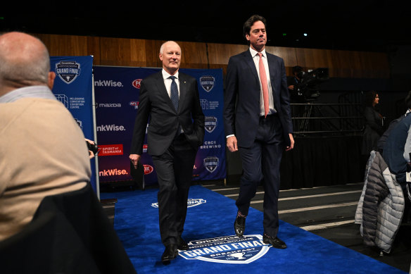 AFL Commission chairman Richard Goyder (left) and AFL CEO Gillon McLachlan arrive at the North Melbourne grand final breakfast on Saturday.