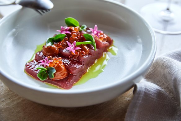Raw tuna crudo with harissa, roe, turmeric and ice plant.