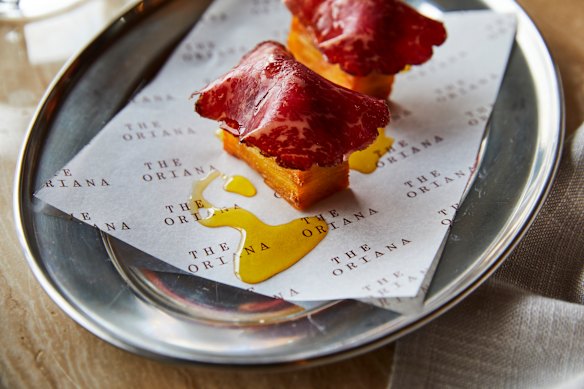 Crisp potato pavé with dry-aged beef tartare and bresaola.