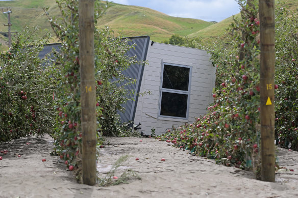 A house was washed into an orchard west of Napier.