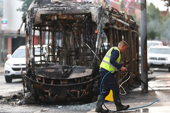 The charred remains of a bus set alight in Belfast.