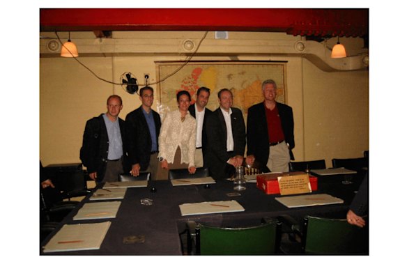 This undated photo shows Ghislaine Maxwell, third from left, actor Kevin Spacey, second from right, and former President Bill Clinton, far right, with a group of unknown people. 